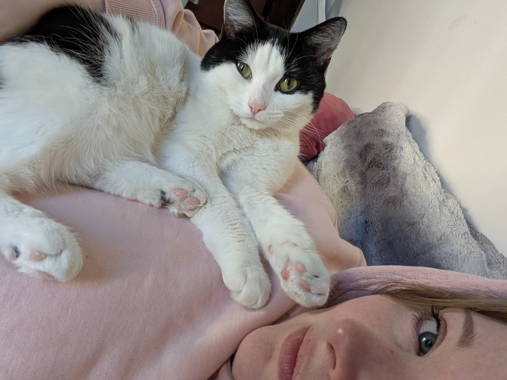 Sarah with her black-and-white cat
